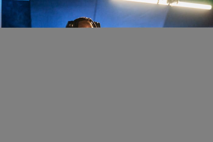 Justin Jefferson and London on da Track pose for a picture in a recording studio.